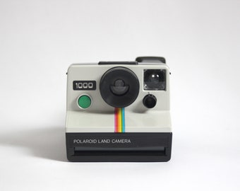 Appareil photo Polaroid 1000 Land / Appareil photo Polaroid Rainbow - bouton d'obturateur vert