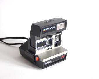 Appareil photo argentique Polaroid Sun 600 LMS + étui de