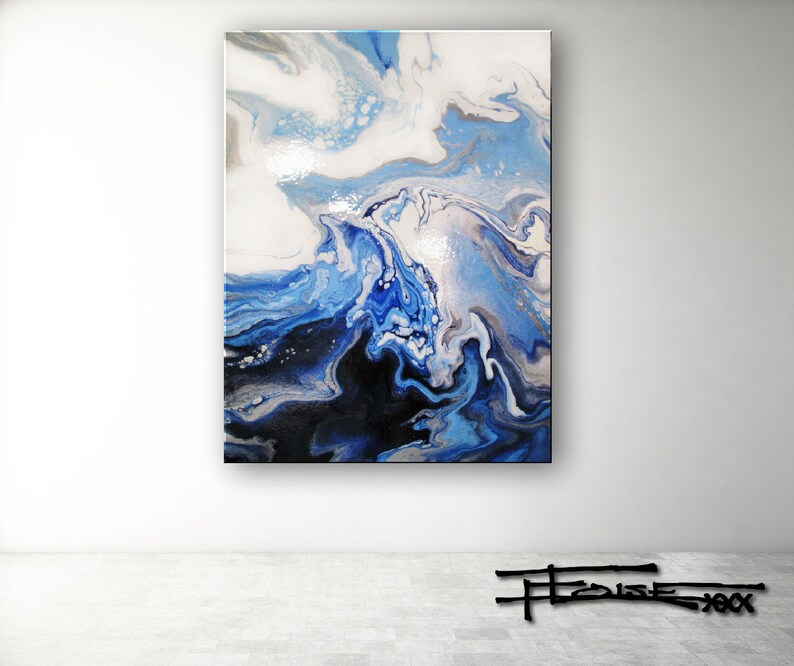 May include: Abstract painting with swirling blue, white, and black paint. The colors blend together to create a dynamic and fluid design.