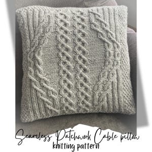 May include: A gray knitted pillow with a cable knit pattern. The pillow is seamless and has a patchwork design. The text "Seamless Patchwork Cable Pillow knitting pattern" is visible at the bottom of the image.