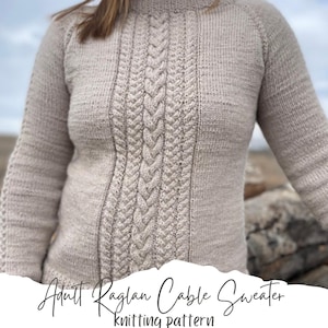 May include: A beige knitted sweater with a cable knit pattern. The sweater has a raglan sleeve and a high neckline. The text "Adult Raglan Cable Sweater knitting pattern" is written on the bottom of the image.