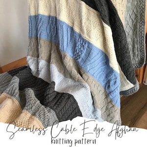 May include: A knitted blanket with a cable edge pattern in shades of blue, grey, and beige. The blanket is folded and draped over a wooden chair. The text "Seamless Cable Edge Afghan knitting pattern" is visible at the bottom of the image.