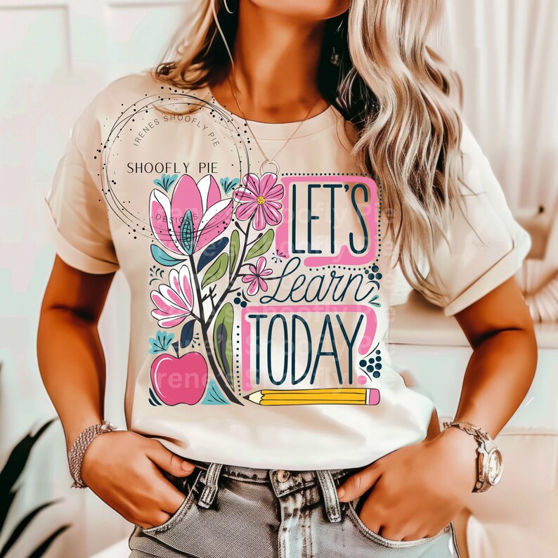 May include: A beige t-shirt with a floral design and the text "Let's Learn Today".