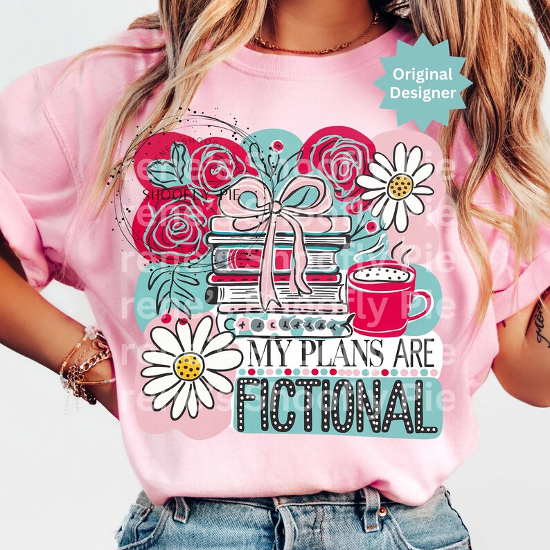 May include: Pink t-shirt with a graphic design featuring a stack of books tied with a pink bow, red roses, daisies, and a red coffee mug. The text "MY PLANS ARE FICTIONAL" is displayed below the books.