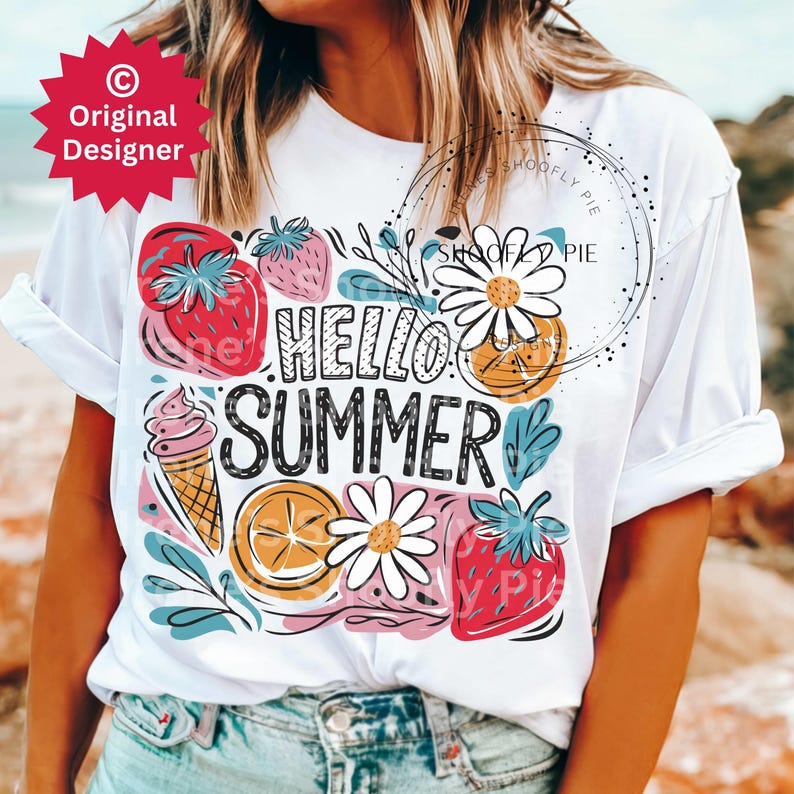May include: White t-shirt with a colorful graphic design featuring the text "Hello Summer" surrounded by strawberries, daisies, lemons, and an ice cream cone.
