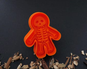 Cortador de relieve con expulsor - hombre de jengibre, esqueleto