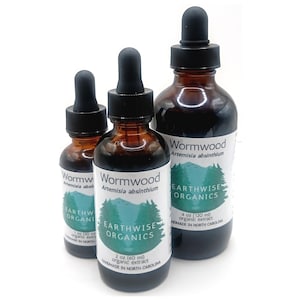 May include: Three amber glass bottles of Wormwood organic extract with black droppers. The bottles have white labels with green tree graphics and the text "Earthwise Organics". Sizes are 1 oz, 2 oz (60 ml), and 4 oz (120 ml).