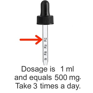 May include: A clear glass dropper with a black rubber bulb and a graduated scale in milliliters. The scale shows measurements from 0.25 mL to 1.0 mL. The text below indicates the dosage is 1 ml and equals 500 mg.