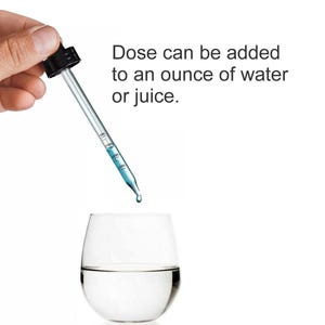 May include: A clear glass with water is shown below a dropper dispensing a blue liquid. The dropper is held by a hand and has measurements in milliliters. Text reads: "Dose can be added to an ounce of water or juice."