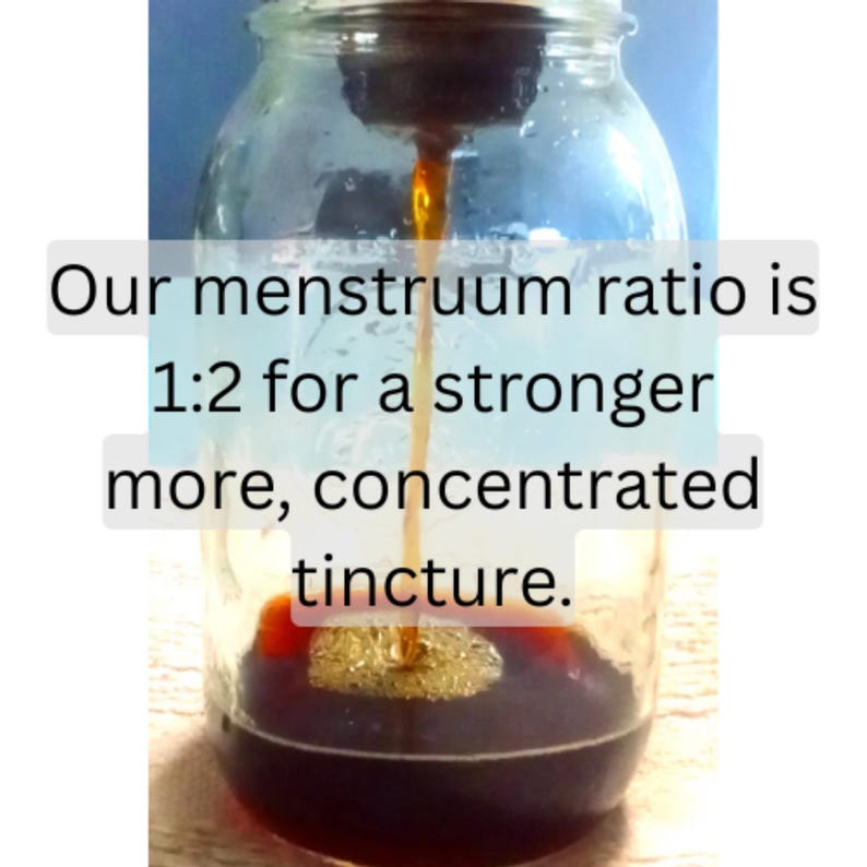 May include: A clear glass jar with a dark liquid being poured into it. The text on the image reads: "Our menstruum ratio is 1:2 for a stronger more, concentrated tincture."