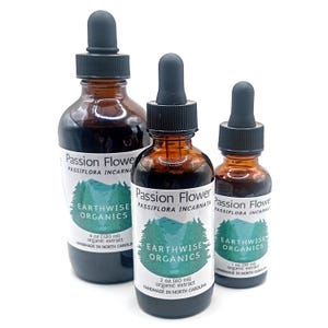May include: Three amber glass bottles of organic passion flower extract with black droppers. Each bottle has a white label with the text "Passion Flower" and "Earthwise Organics". The bottles are 1 oz, 2 oz, and 4 oz.