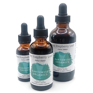 May include: Three amber glass bottles of Red Raspberry Leaf extract with black droppers. The bottles have white labels with green tree graphics and the text "Earthwise Organics". Sizes include 1 oz (30 ml), 2 oz (60 ml), and 4 oz (120 ml).