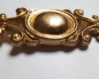 Marion Godart brooch, old stock, golden baroque form