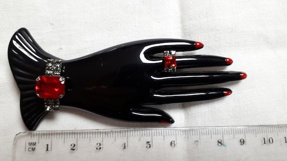 Marion Godart HAND brooch, black resin, red rhines