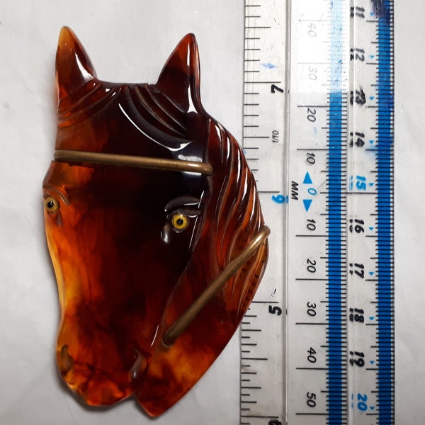 HORSE HEAD BROOCH, bakelite or lucite, torty tea, mottled treacle tone, glass eyes, forties