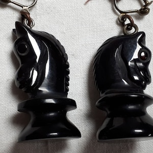 Black carved bakelite CHESS clipback earrings, horse heads, chess pieces