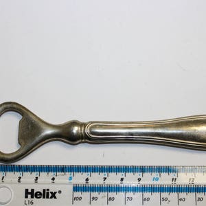 Bottle opener, sterling silver on brass
