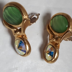 May include: Gold tone clip-on earrings with green and iridescent stones.