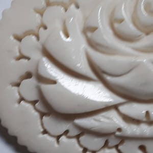 Hand carved bovine bone brooch, rose, thirties