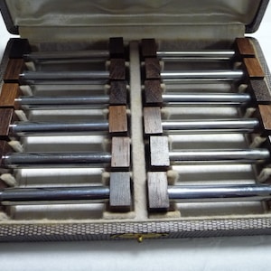 Art Deco knife rests - palisander wood and chrome, boxed.