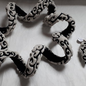 TZURI GUETA, haute couture designer, silicone lace, black & white coil necklace