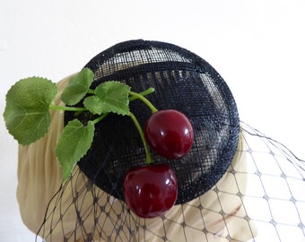 Black Forest fascinator, cherries, black sinamay base, veiling