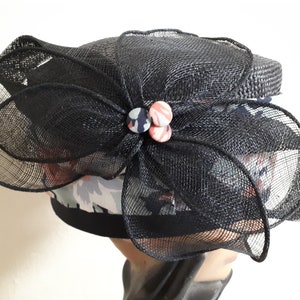 Navy straw pillbox hat, size 56, straw and  floral embellishment