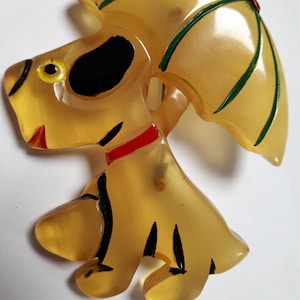 BAKELITE brooch, dog with umbrella, perfect condition.