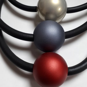 Rubber necklace with huge red pearl, magnetic clasp