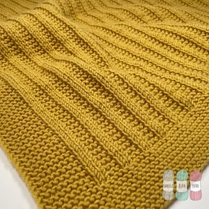 May include: Close-up of a knitted fabric in a deep yellow colour. The fabric has a ribbed texture and is made with a fine yarn.