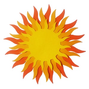 May include: A layered paper sun with orange, yellow and red flames. The sun is a craft project for a classroom or home decor.