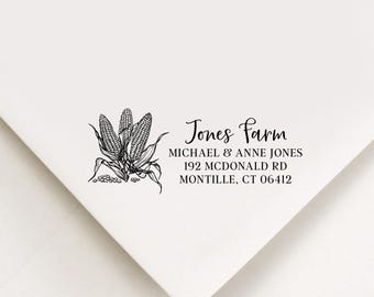 May include: White envelope with a black illustration of three corn stalks and the text "Jones Farm". The text includes the names Michael & Anne Jones and an address in Montville, CT.