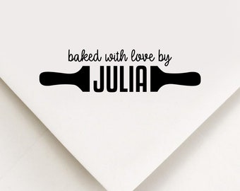 May include: Black and white graphic of a rolling pin with the text "baked with love by JULIA" above it.