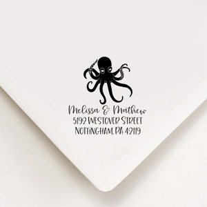 May include: Black and white rubber stamp with an octopus design. The stamp also includes the text "Melissa & Matthew", "5192 Westover Street", and "Nottingham, PA 42119".