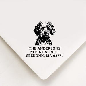 May include: Black and white illustration of a dog's head with the text "THE ANDERSONS 73 PINE STREET SEEKONK, MA 02771"