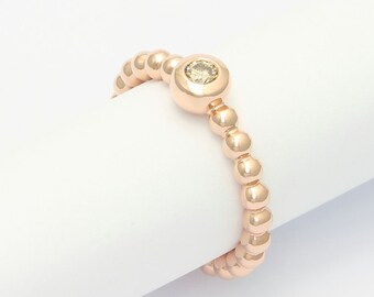 Bead ring with cinnamon-coloured brillant made of 750/- red gold