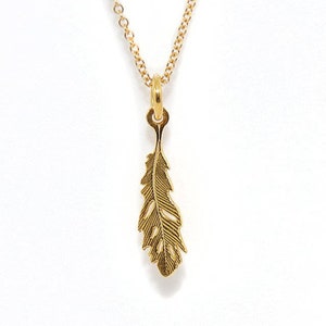 Tiny gold feather necklace