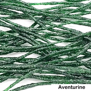 May include: A collection of thin, dark green aventurine strands with a textured, crystalline surface. The individual cords are layered and intertwined, displaying a deep forest green hue with subtle sparkling inclusions throughout the material.