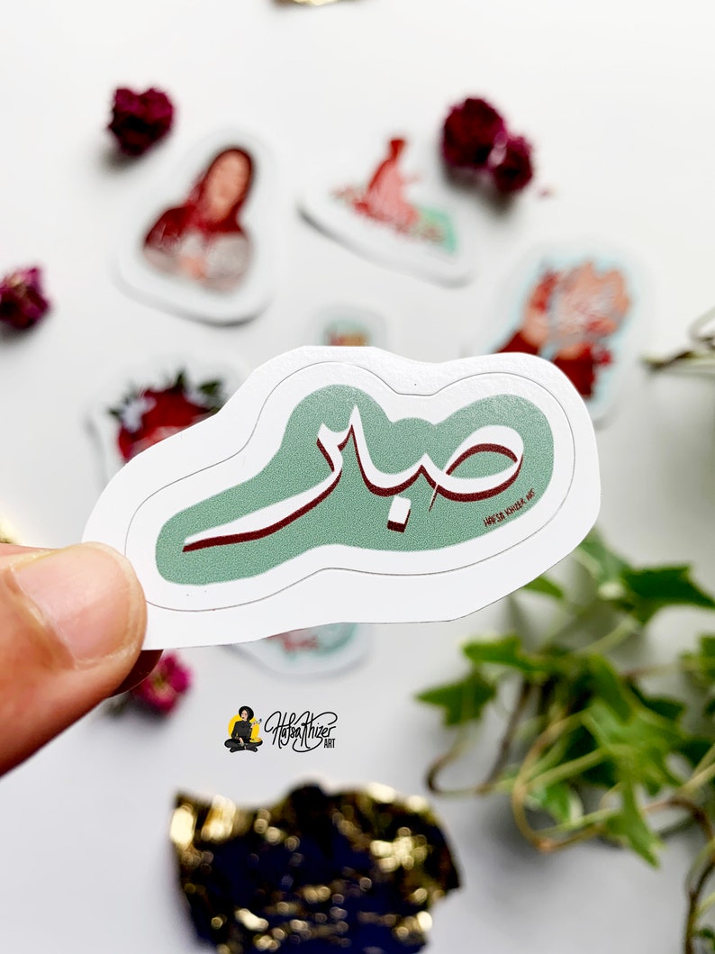 May include: A green and red sticker with Arabic calligraphy that says "Sabah" which means "Morning" in Arabic.