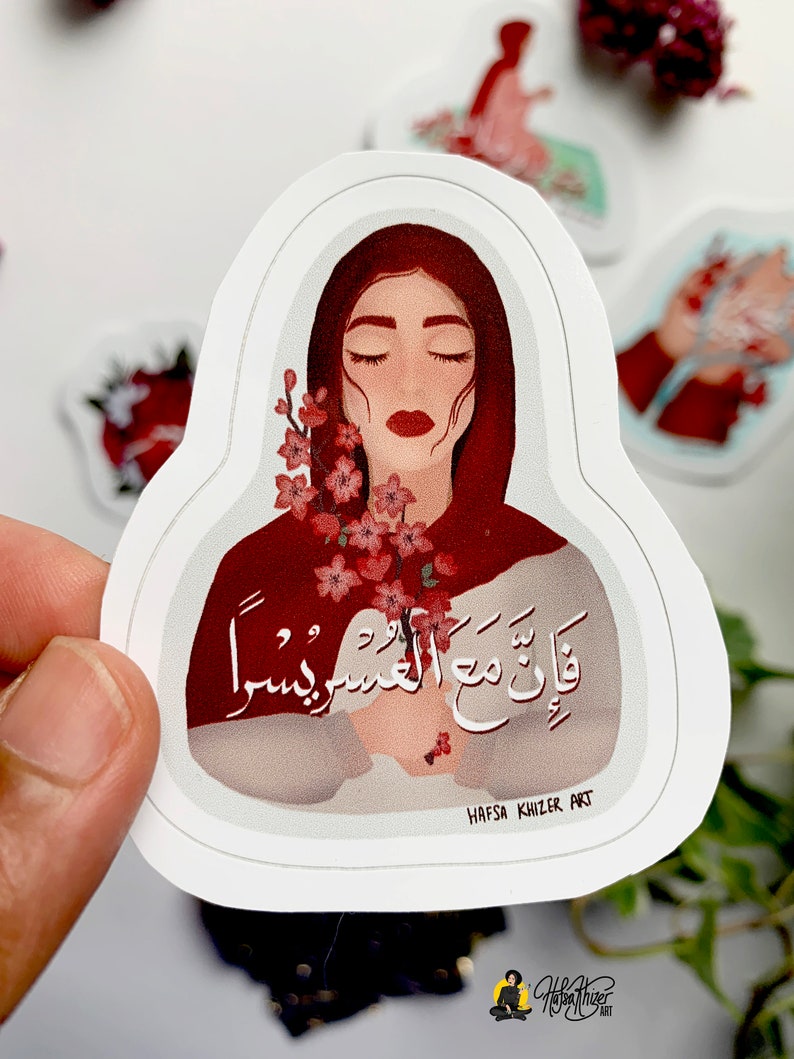 May include: A sticker featuring a woman with closed eyes holding a bouquet of pink flowers. The woman is wearing a red headscarf and the background is white. The sticker has the text "قَالَتْ مَعَ الْعَسِيرِ يَسِيرُ" in Arabic script and the text "HAFSA KHIZER ART" in black text.