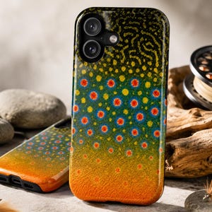 May include: A smartphone case featuring a vibrant brook trout skin pattern with a dark green, vermiculated back, transitioning into a yellow-green midsection with red and blue spots, and a bright orange base, with dual camera cutouts at the top.