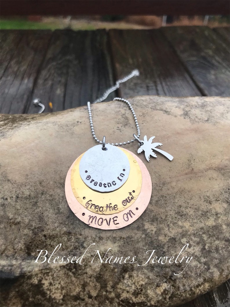 Hand Stamped Stainless Steel, Bronze and Copper Breathe In, Breathe Out, Move On necklace Jimmy Buffett round w/palm tree