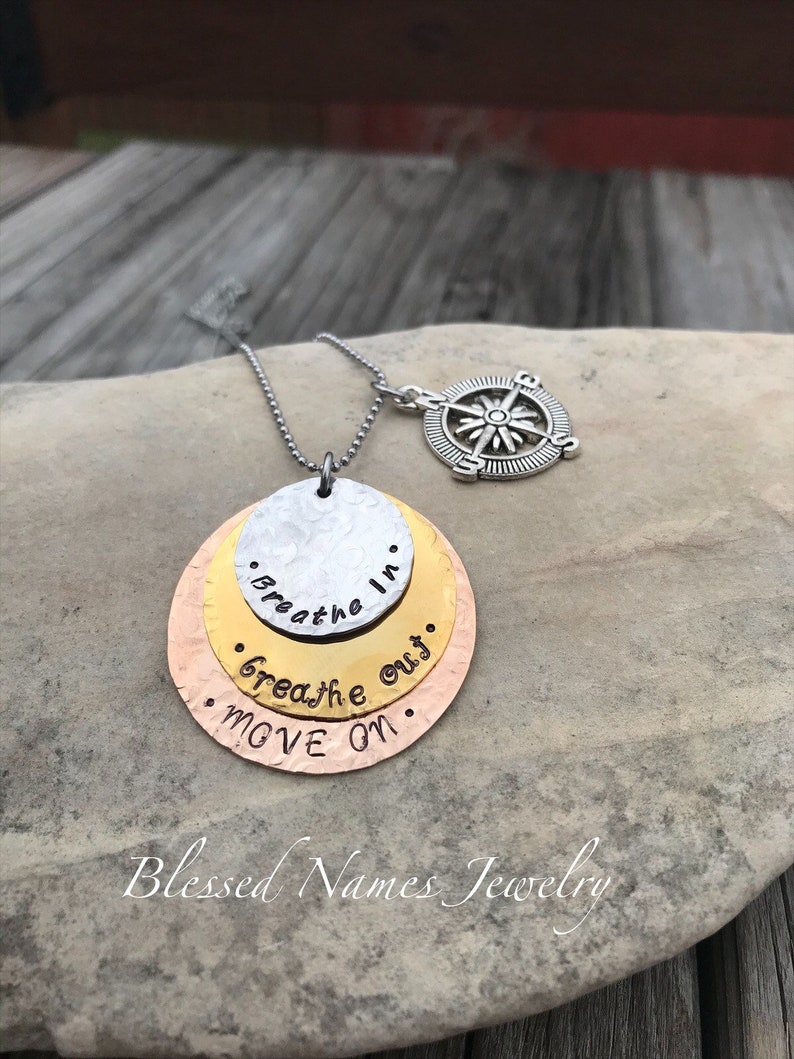 Hand Stamped Stainless Steel, Bronze and Copper Breathe In, Breathe Out, Move On necklace Jimmy Buffett round w/compass