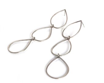 Teardrop triple drop earrings. Sterling silver, hand formed post and dangle earrings.