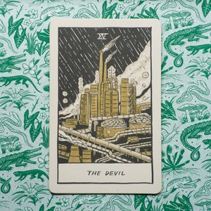 The Devil Tarot Card, showing a liquefied natural gas factory spewing pollution into the air.