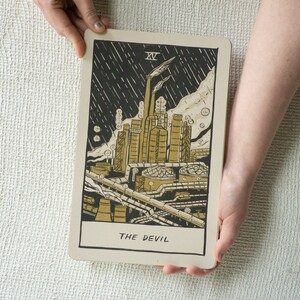 The Devil Tarot Card, showing a liquefied natural gas factory spewing pollution into the air.
