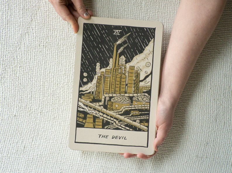 The Devil Tarot Card, showing a liquefied natural gas factory spewing pollution into the air.