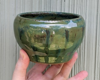 Small handmade ceramic pot in seaweed witch glossy green.