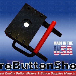 May include: A black button maker with a red handle. The machine is made in the USA. The text "ProButtonShop" is displayed in large black letters with the tagline "The Best Quality Button Makers & Button Supplies Made in U.S.A."