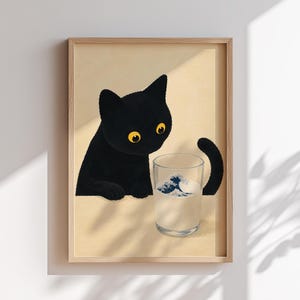 May include: A framed art print featuring a black cat with yellow eyes gazing at a glass of milk. The glass has a blue and white wave design. The background is a light beige color.